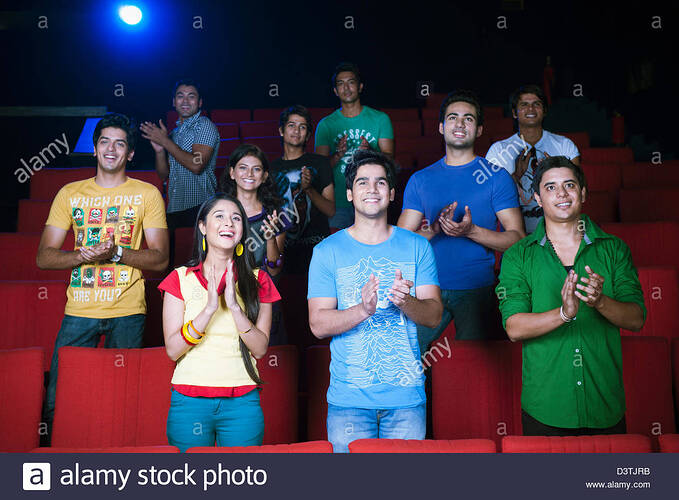 youngsters-applauding-in-a-cinema-hall-D3TJRB